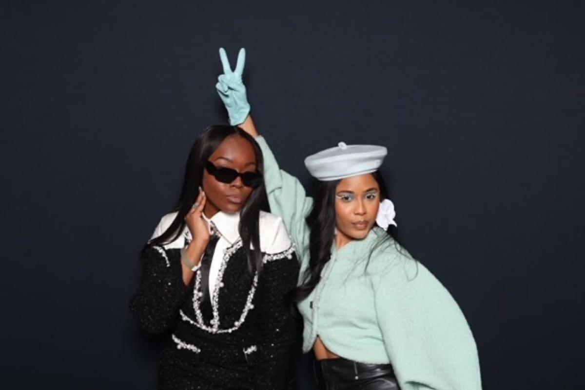 Two guests striking a pose in a Philadelphia photo booth